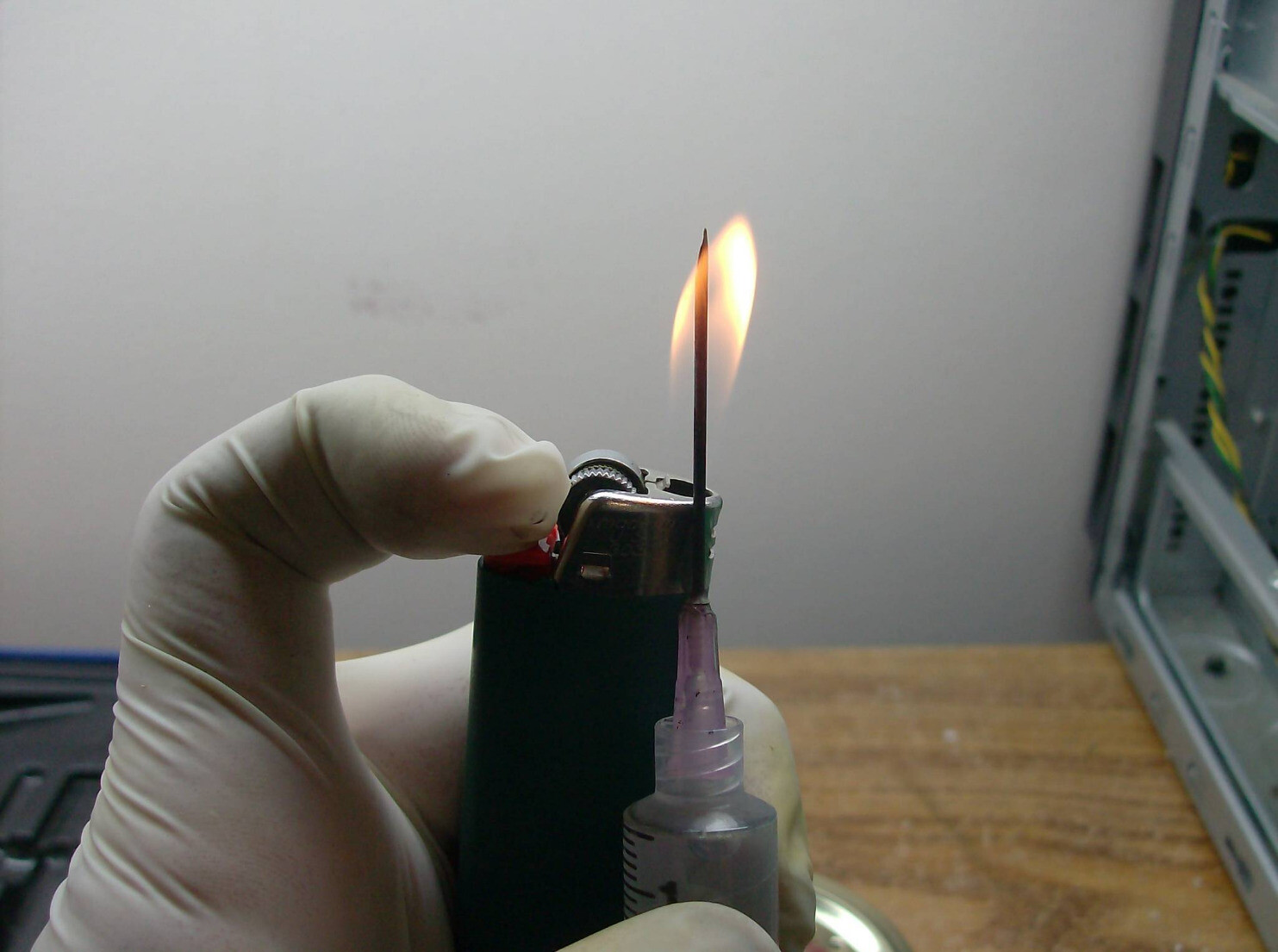 sterilizing needle with a lighter