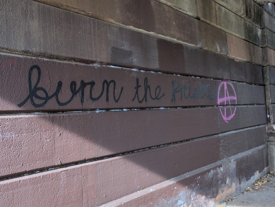 Grafitti saying burn the prisons